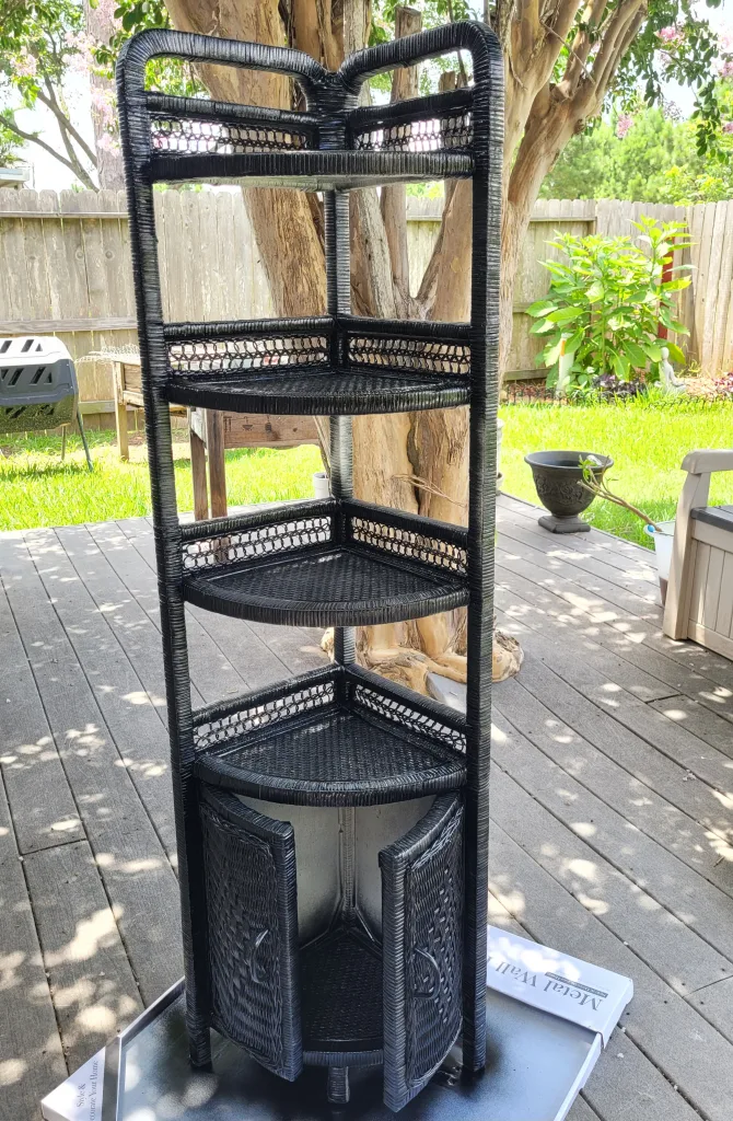 Rustoleum Black Gloss painted rattan wicker corner shelf. Boho Glam Bliss: Budget Guest Bedroom Transformation For Under $1000