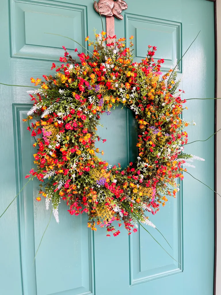 Wildflower wreath on a blue door. Top florals to Make Beautiful Spring Wreaths