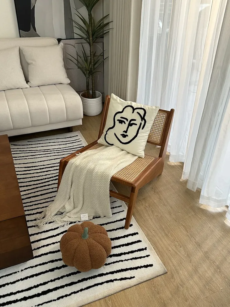 Handmade Rattan Chair With Rustic Japandi-Inspired Design - Interior Designer Secrets for Making Any Space Feel Luxurious