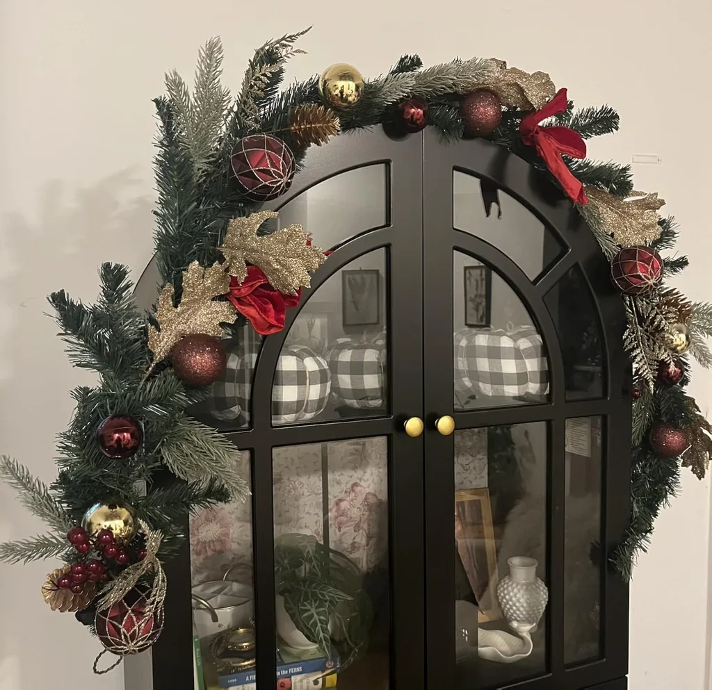 Beautiful Designer Christmas Decor Dupes You Can Buy or DIY - Lighted Christmas garland with red gold ball and ribbons